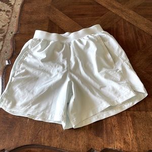 Under armour light green shorts with liner,  size small.